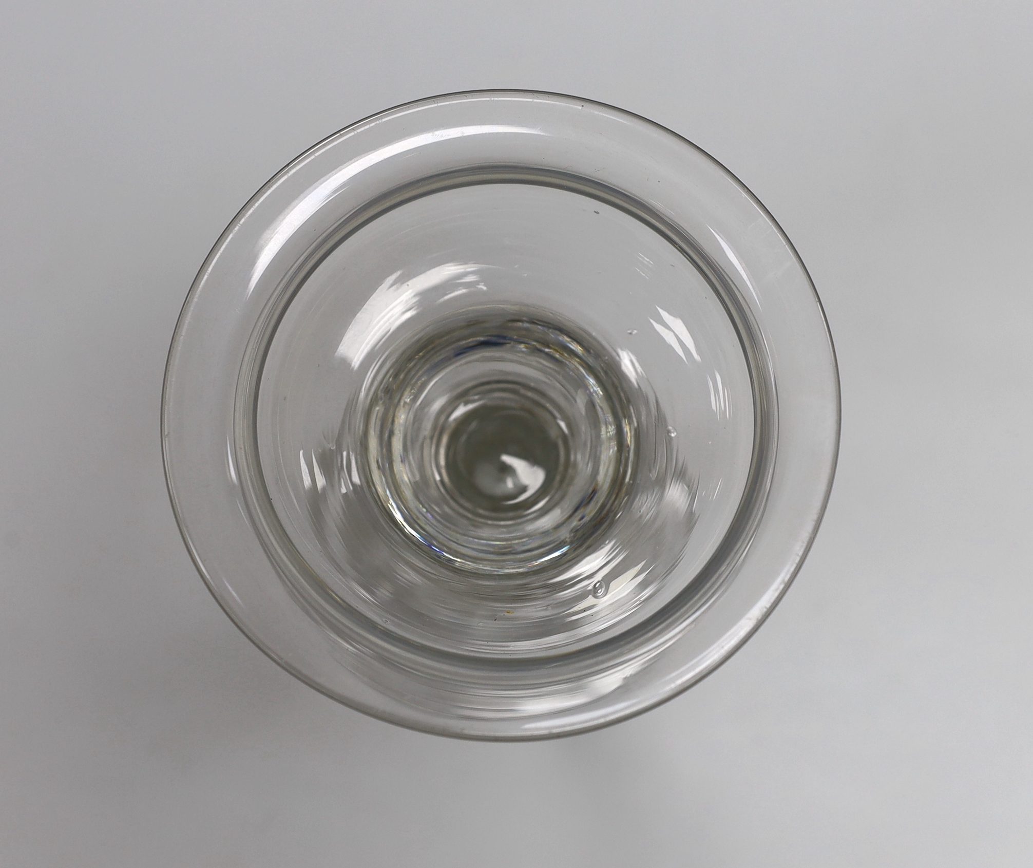 An English lead crystal champagne or sweetmeat glass, c.1745, flat double ogee bowl with everted rim, on double collar, eight sided Silesian stem on double collar, domed, folded foot, rough pontil, 15.6cm high